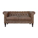 A double-seater Chesterfield sofa in brown leather.